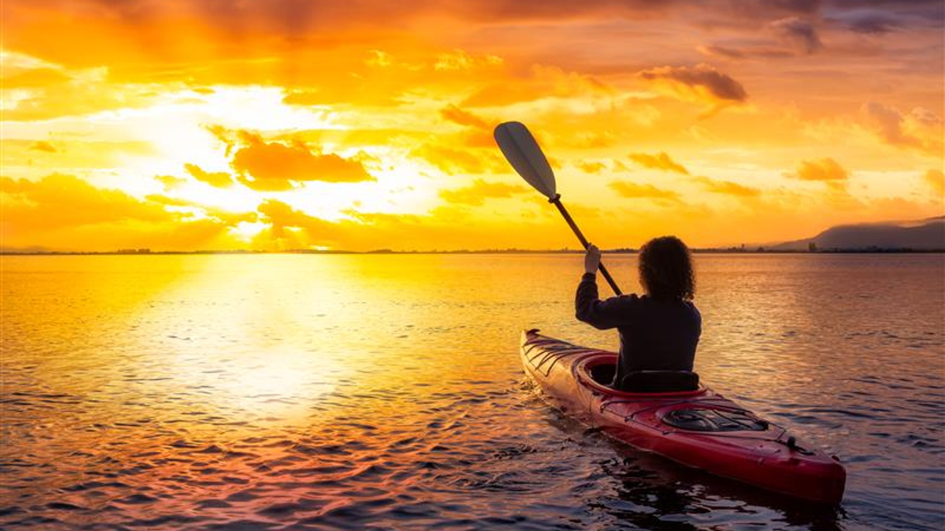 Kayaking during a Colourful Sunset.