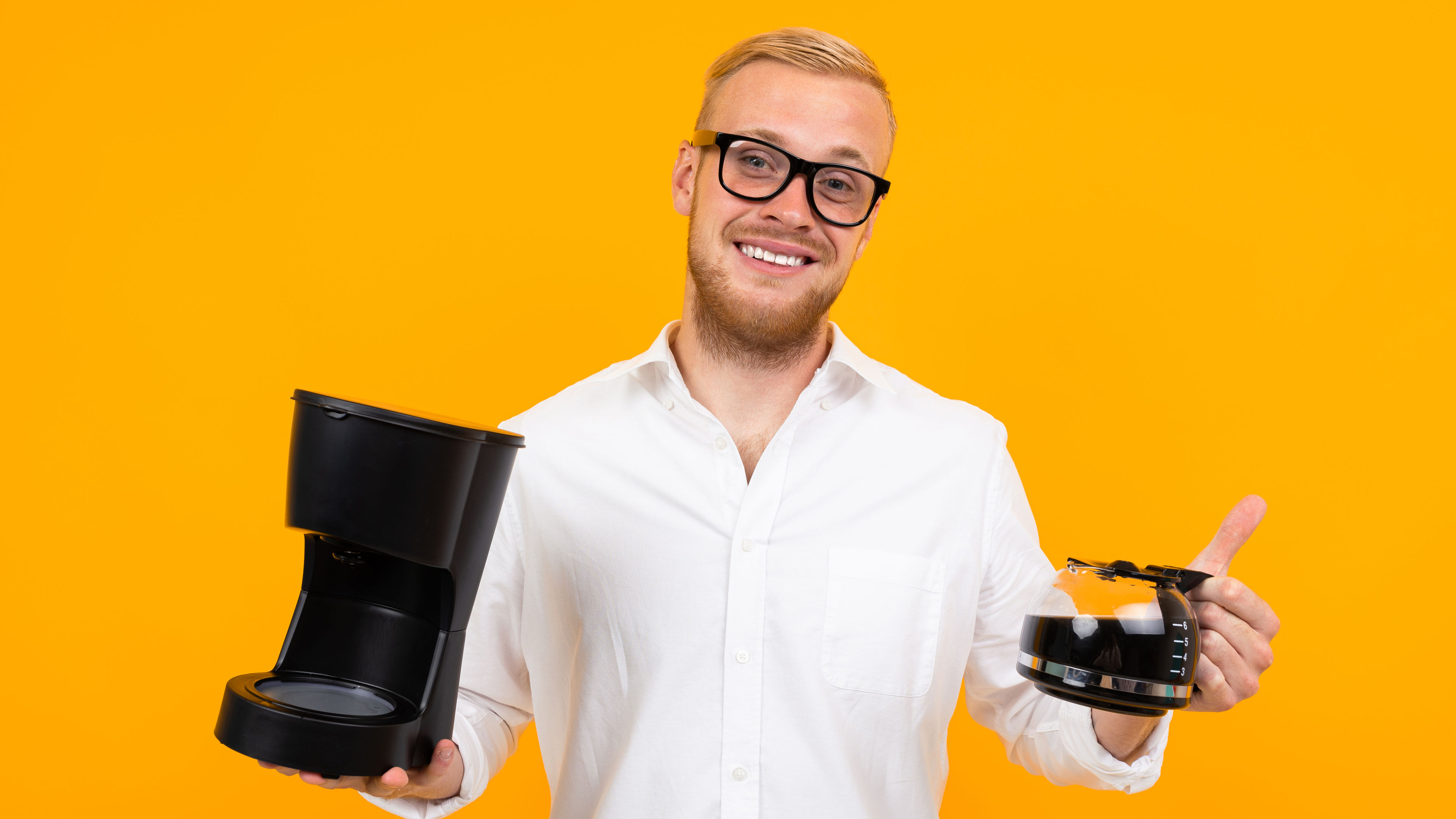 Man Holds Coffee Maker 