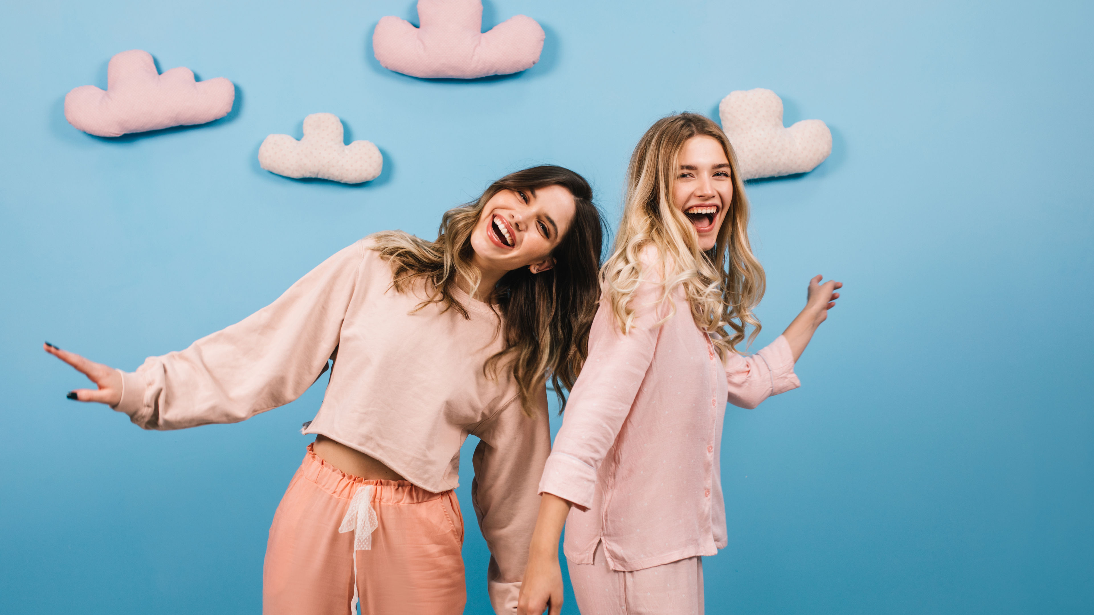 Smiling friends dancing together