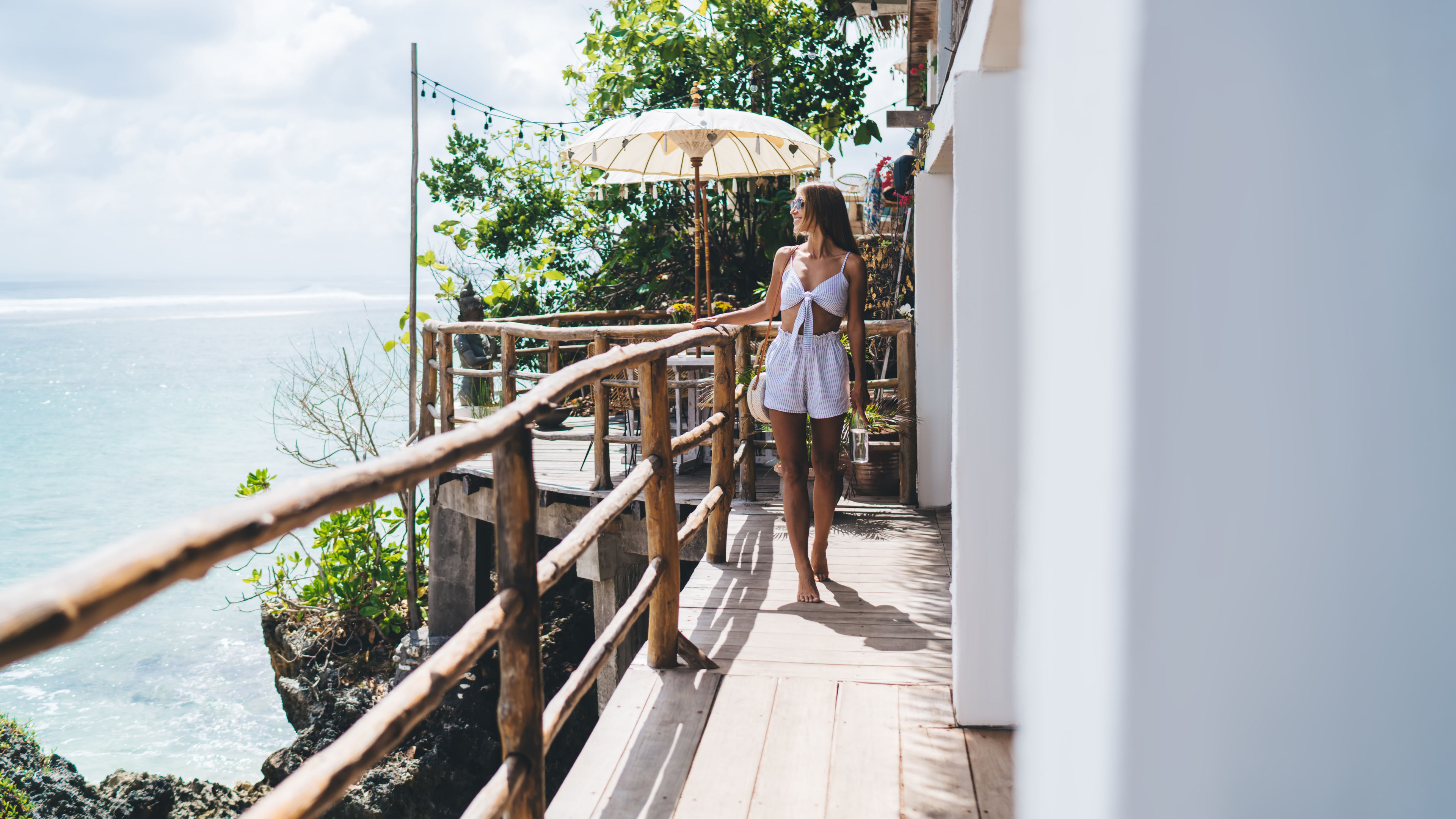 Smiling lady walking on terrace