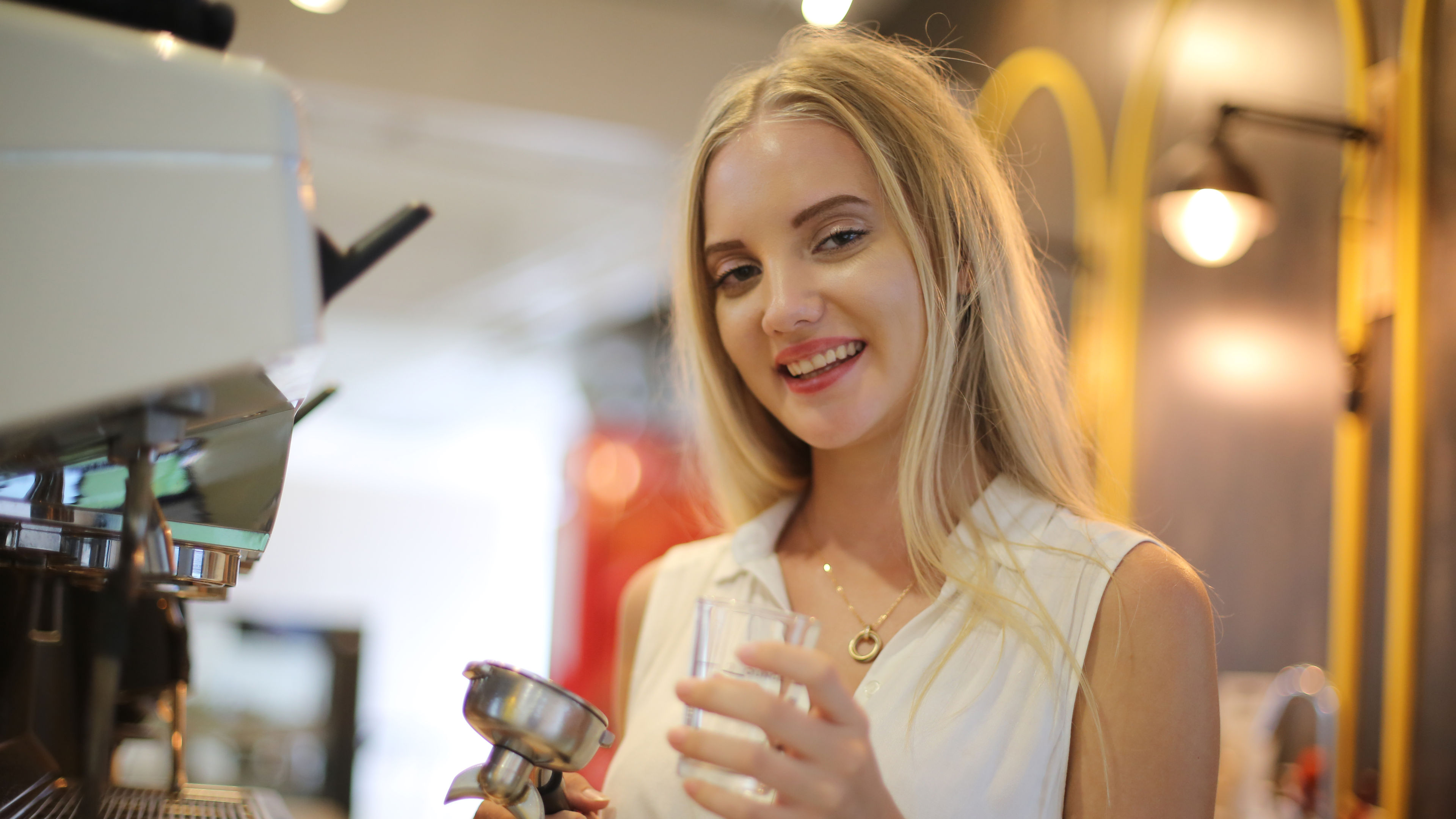 Smiling Woman Holding Coffee Filter