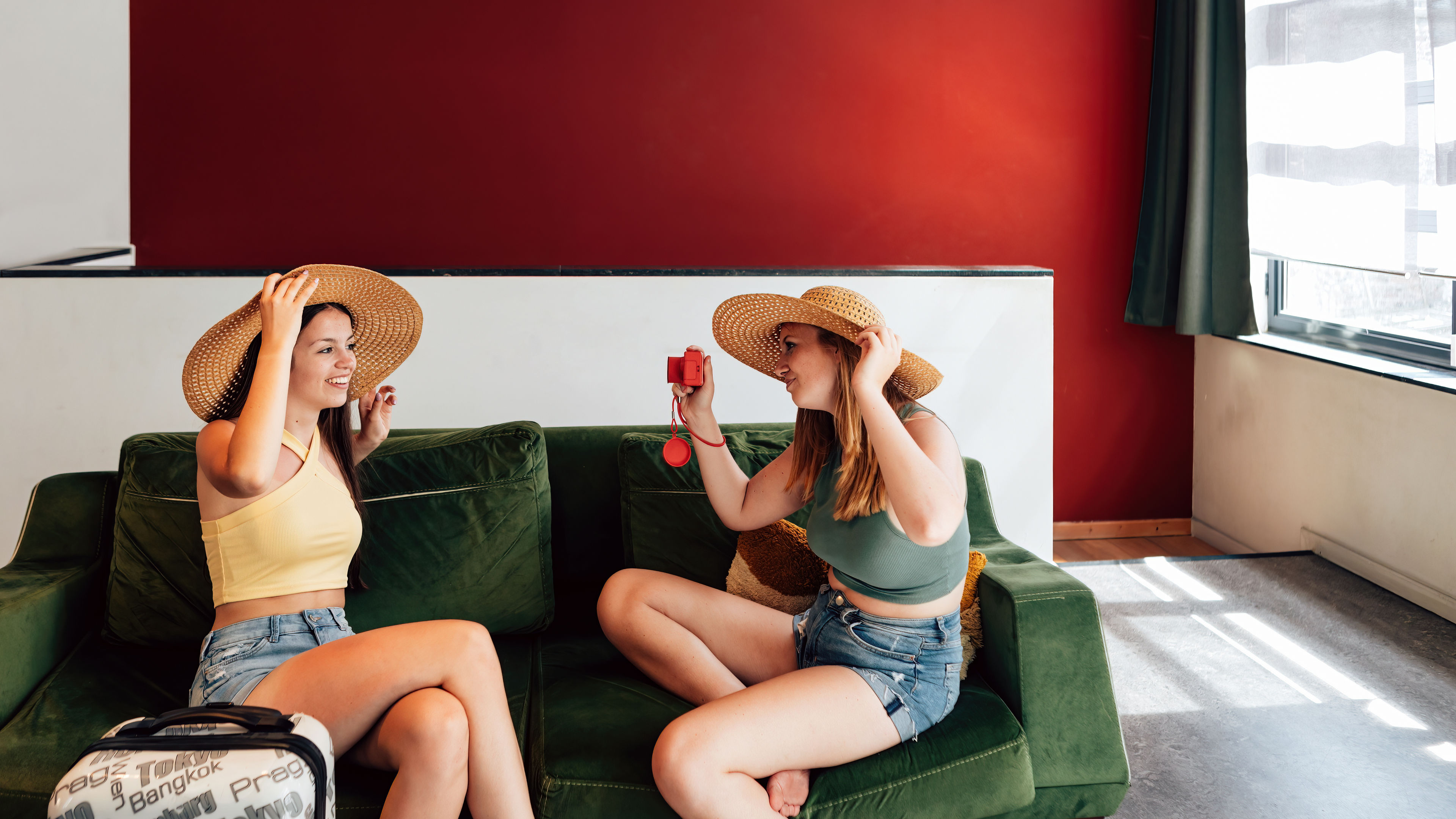 Two Smiling Women with Camera