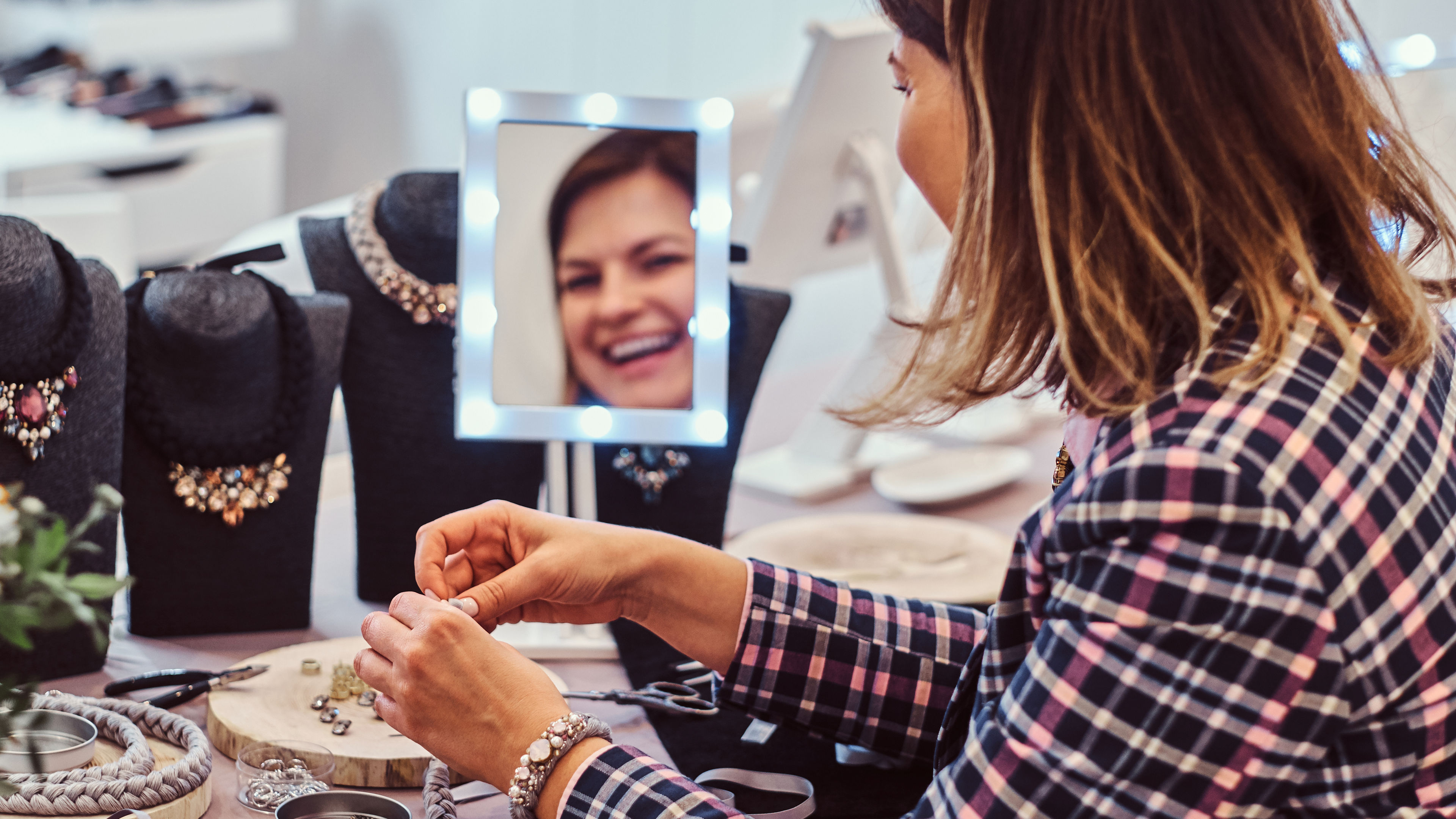 Woman holding necklace