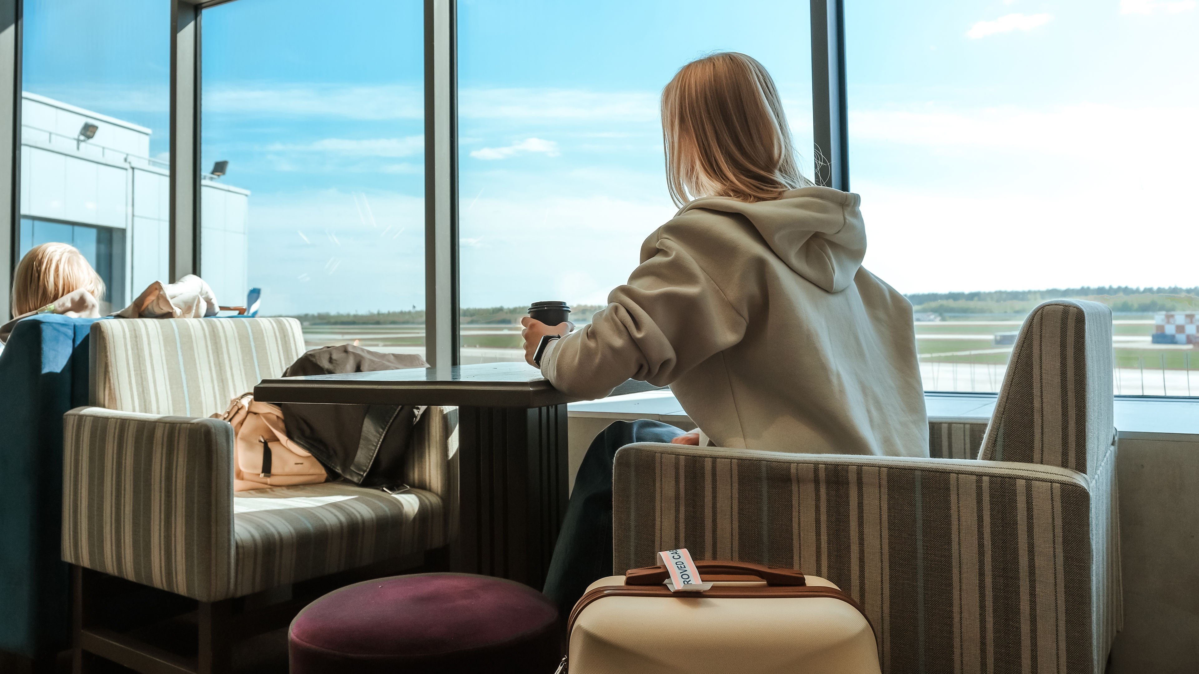  Woman in airport lounge  