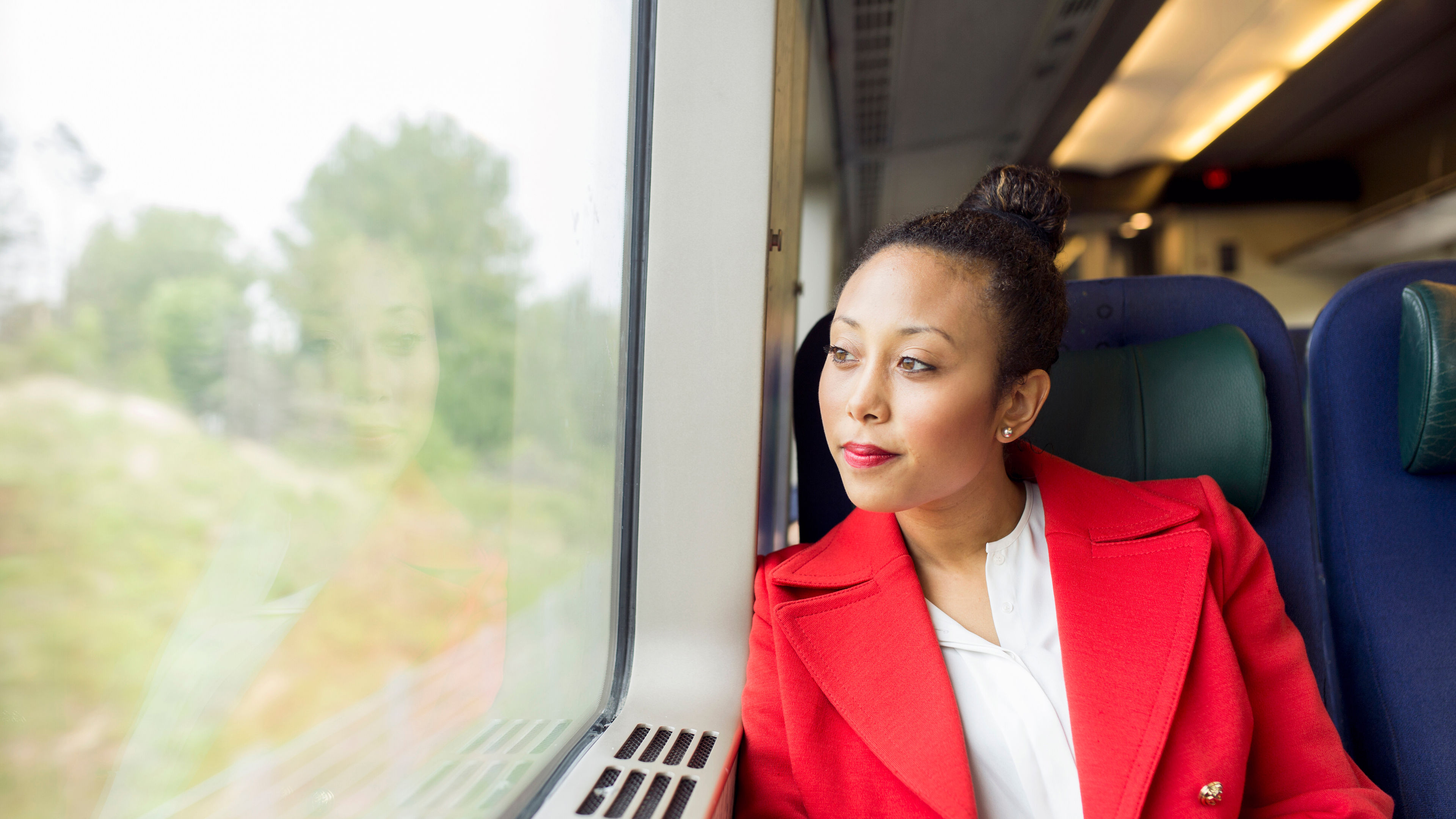 Woman in red in train 